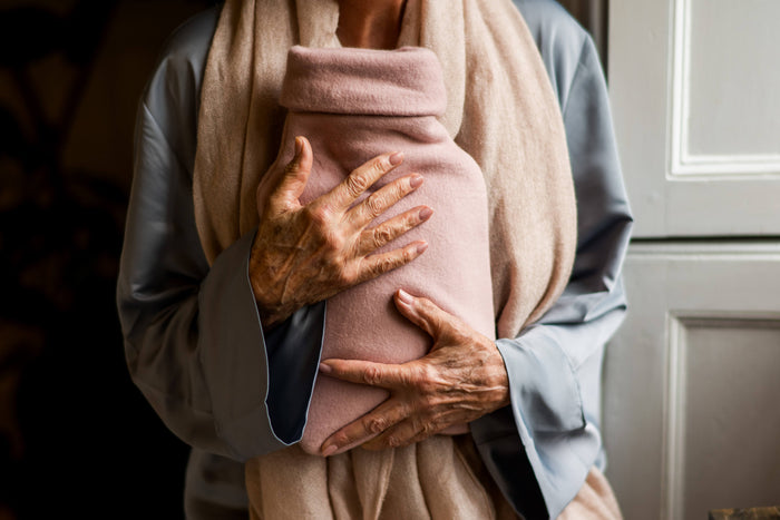 Rubber hot water bottle and cover